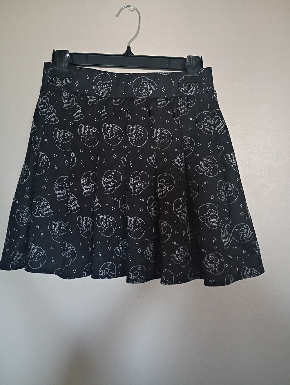Spencer's Black Skull Print A-Line Skirt.